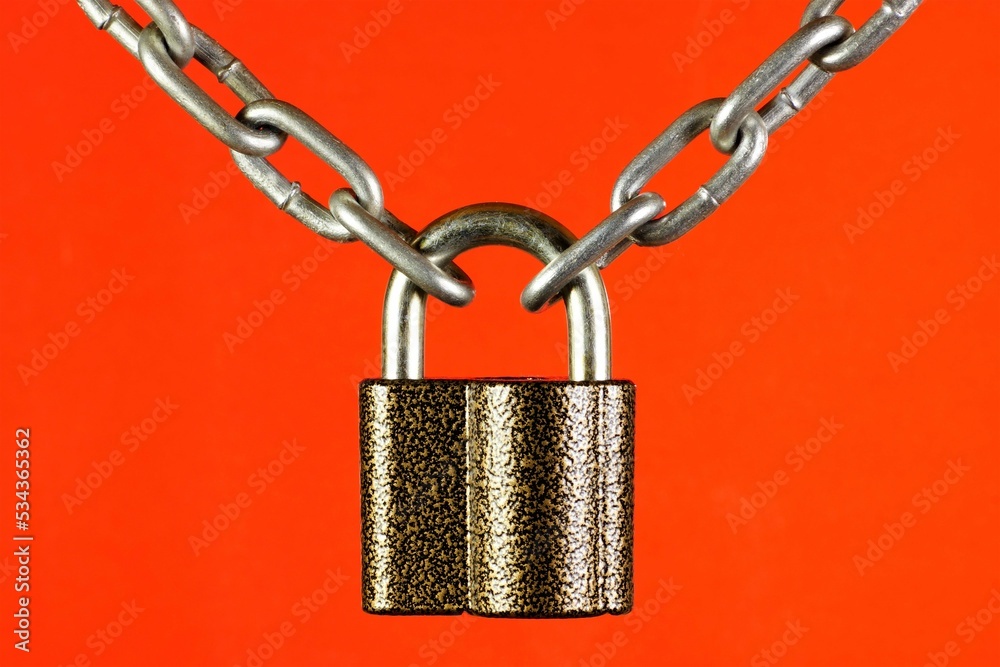 The chain is connected by a lock, on a red background. The concept of ...