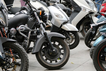 Black Chopper With Other Motorbikes On Street