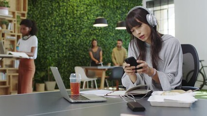 Aufkleber - Woman, writing and notebook on table at startup, office or workplace, listening to music on phone. Girl, laptop and at tech company with smartphone on web for communication, writing notes and idea