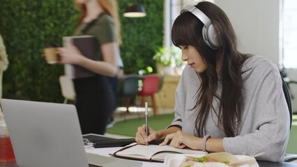 Aufkleber - Headphones, laptop and notebook writing for woman in busy office, digital marketing startup and creative brand company. Thinking, learning and working employee with technology in Vietnamese business