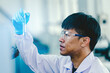 © Chocheng channel - Asian male medical or scientific researcher or doctor Working in The Laboratory.Advanced Scientific Lab for Medicine, Biotechnology, Microbiology Development