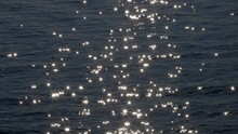 Slow Motion Of Sun Reflecting On Sparkling Blue Sea. Sunrise At The Sea Or Ocean