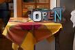 An 'open' sign in a street cafe in Italy