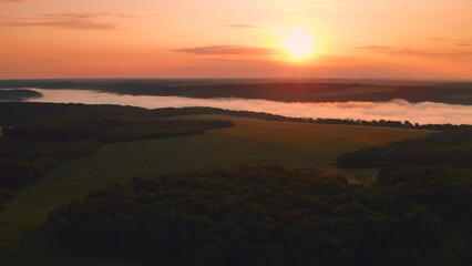 Autocollant - Panoramic view from a drone flying over a rural landscape at dawn. UHD 4k video.