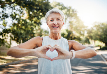fitness, happy and heart hands of old woman in nature after running for health, wellness and workout