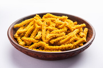 Wall Mural - Bhajni chakli sticks or crunchy murukku snack made using diwali festival, favourite munching food