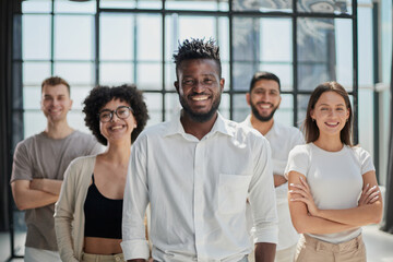 Smiling professional business leaders and employees group team portrait