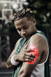 © C Coetzee/peopleimages.com - Arm injury, pain and athlete sport muscle inflammation of a black man with a medical issue. Basketball player holding a sports emergency accident after exercise, fitness and game match workout