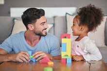 Children, Family And Education With A Girl And Her Father Playing With Building Blocks In The Living Room Of Their Home. Love, Learning And Toys With A Foster Parent And Adopted Child Together