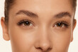 © master1305 - Brown eyes. Close up portrait of beautiful young girl looking at camera. Lamination of lashes and eyebrows