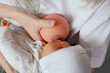 © Татьяна Волкова - Photo of hands holding model of female breast and baby doll closeup. Training for pregnant women with qualified lecturer. Online study, lactation, nutrition, breast feeding, newborns care