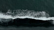 © Lukas Gojda - Beautiful aerial view of black beach. Sea ocean waves reaching shore.