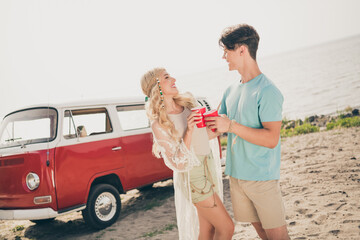 Poster - Photo of two romantic fellows enjoy love toast drink beer wear casual outfit nature seaside beach outside