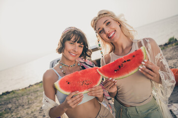 Canvas Print - Photo of youngster sisters people 60s style picnic hold slice watermelon wear boho outfit nature seaside beach outside