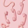 Creative layout with pink retro phone handsets on pastel pink background. 80s or 90s retro fashion aesthetic telephone concept. Minimal romantic handset idea. Valentines day idea.