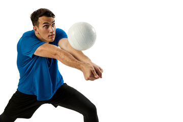 Closeup of young man, volleyball player playing volleyball isolated on white studio background. Sport, gym, team sport, challenges