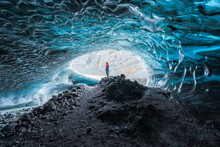 Traveler Inside Ice Cave In Daytime