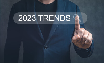 Poster - 2023 Trands. Businessman hand pushing virtual search bar. Businessman hand touching to search engine browser icon to input and finding new business trends
