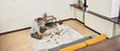 © Svitlana - Dad and son play with construction set on carpet