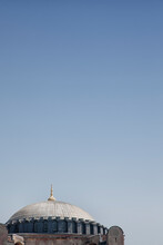 Istanbul, View Of A Historic Building, A Dome And A Gold Colour Roof Finial.