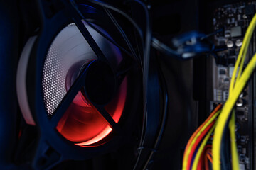 Poster - Glowing computer cooler while working close-up. Inside the computer.