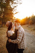 © maxbelchenko - Happy couple in love newlyweds in casual clothes travel together, hike and walk in the autumn forest in nature.