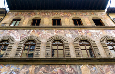 Wall Mural - Old painting on building exterior, historic fresco outdoor, Florence, Italy