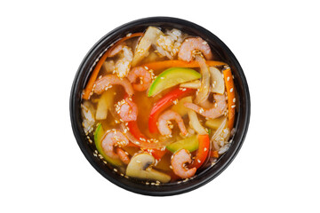 Poster - Instant soup, noodles wok, with vegetables, herbs and sesame. In a black round plate. On a white background.