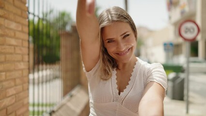 Sticker - Young caucasian woman smiling confident doing photo gesture with hands at street