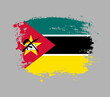 Elegant grungy brush flag with Mozambique national flag vector