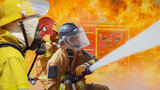 Fototapeta Sport - Fireman,Firefighter training Firefighters using water and fire extinguishers to fight the flames in emergency situations. in a dangerous situation All firefighters wear firefighter uniforms for safety