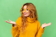 © luismolinero - Young caucasian woman isolated on green screen chroma key background With glasses and having doubts