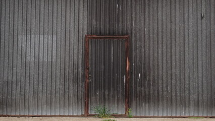 metal door background for access to industrial site