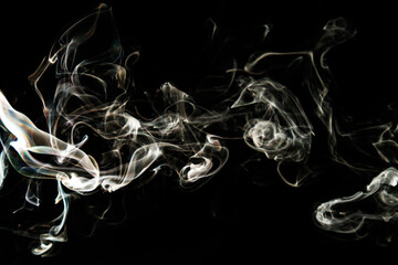 Smoke effect texture. Isolated background. Black and dark backdrop. Smokey fire and mistic effect.