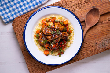 Wall Mural - Marinated chicken with vegetables and couscous. Traditional African recipe.