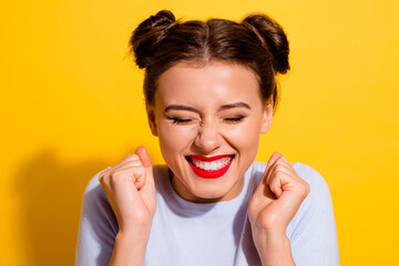 Wall Mural - photo of cheerful funky young female raise fists in excitement win a lot of money isolated on yellow