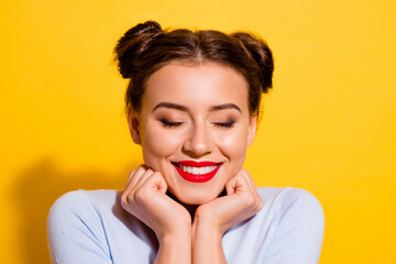 Wall Mural - photo of lovely young peaceful girl with closed eyes showing her beautiful make up isolated on yello