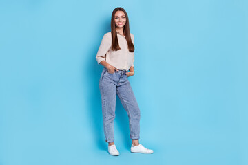 Poster - Full body photo of hr young lady stand wear grey shirt jeans boots isolated on blue color background