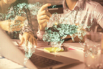 Poster - Double exposure of man and woman on-line shopping holding a credit card and social network theme hologram drawing. People connecting and E-commerce pay on-line concept.