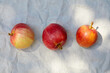 © Tetra Images - Overhead view of three ripe red and yellow apples