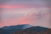 Usa, New Mexico, Santa Fe, Wildfire Smoke Over Sangre De Cristo Mountains At Sunrise