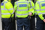 Fototapeta Londyn - Metropolitan Police officer back of the vest in London