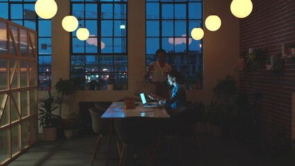 Aufkleber - Night planning, coffee meeting and women in communication about marketing strategy, doing research on laptop and working in collaboration in dark office. Teamwork on business project at startup