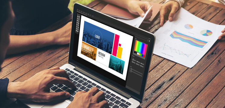 Graphic designer software for modern design of web page and commercial ads showing on the computer screen
