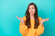 Photo of young adorable gorgeous perfect woman wear yellow pullover shrug shoulders dont know indifferent look empty space isolated on cyan color background