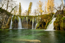 Plitvice Lakes National Park During Colorful Autumn, Croatia, Europe. Fall Colors Leafs On Trees. Waterfalls And Water In Sunny Morning Light With Fog. Landscape Photography. View Of Plitvicka Jezera.