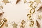 Fototapeta  - Happy New Year 2023 poster. Christmas background with gold 2023 numbers.