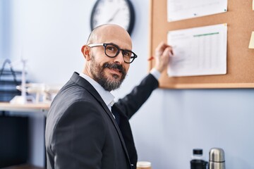 Sticker - Young bald man business worker writing on cork board at office