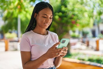 Sticker - African american woman smiling confident using smartphone at park