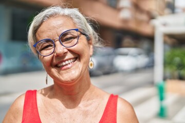 Poster - Middle age grey-haired woman smiling confident standing at street